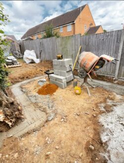 Complete back garden transformation with porcelain paving and artificial lawn