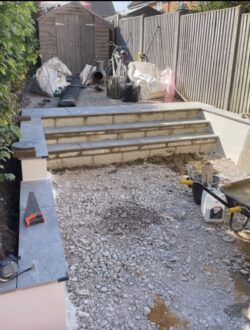 Full-width garden steps with rendered retaining wall in Rickmansworth landscape project