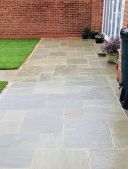 Tiered garden with turfing and rustic sleeper retaining walls