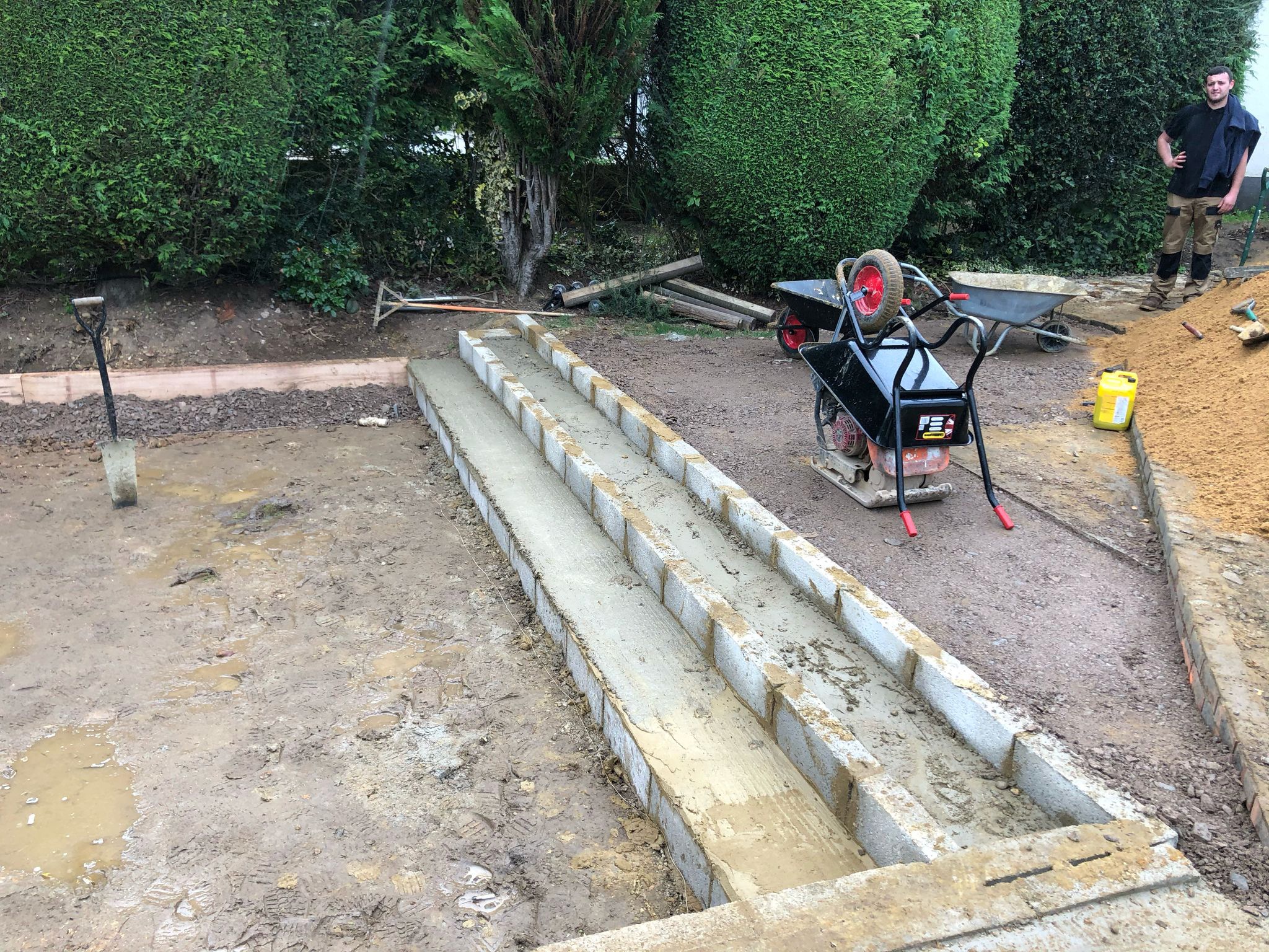 Garden before landscaping with open space prepared for garden room and paving in Hertfordshire